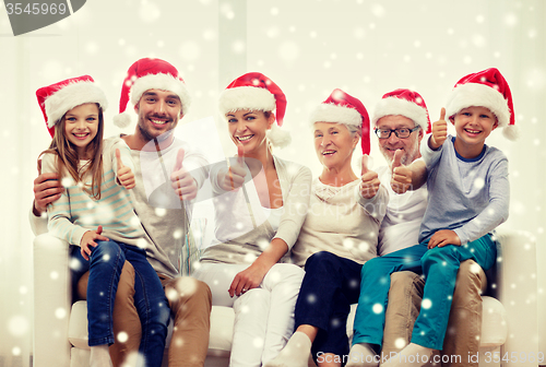 Image of happy family sitting on couch at home