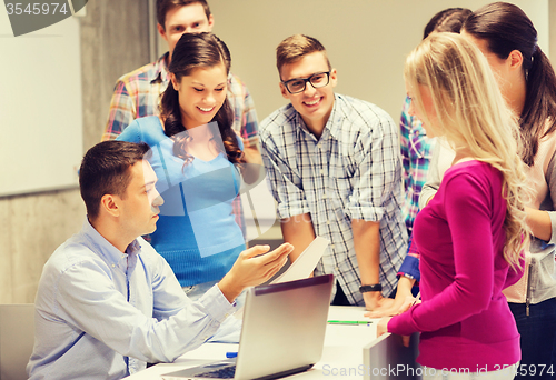 Image of group of students and teacher with laptop