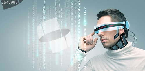 Image of man with futuristic 3d glasses and sensors