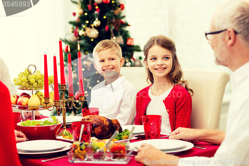 Image of smiling family having holiday dinner at home