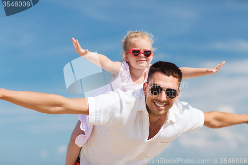 Image of happy family having fun over blue sky background