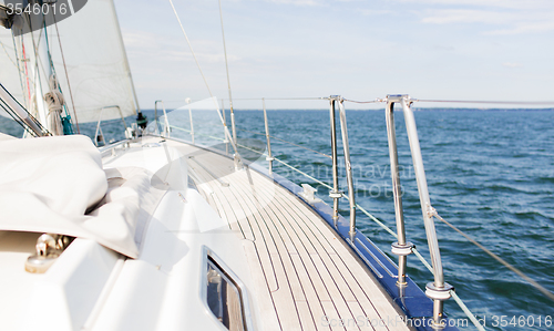 Image of close up of sailboat or sailing yacht deck and sea
