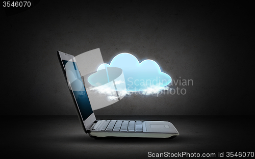 Image of open laptop computer with cloud computing icon