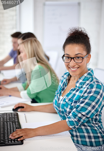 Image of happy high school students in computer class