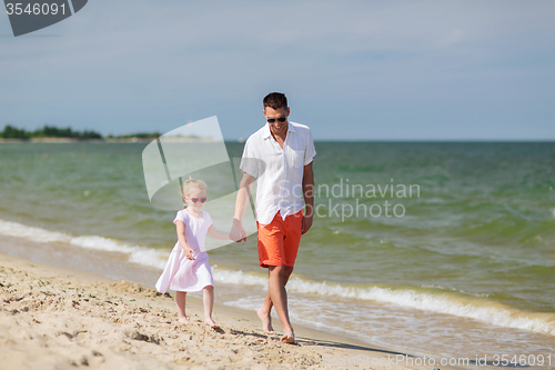 Image of happy family in sunglasses on summer beach