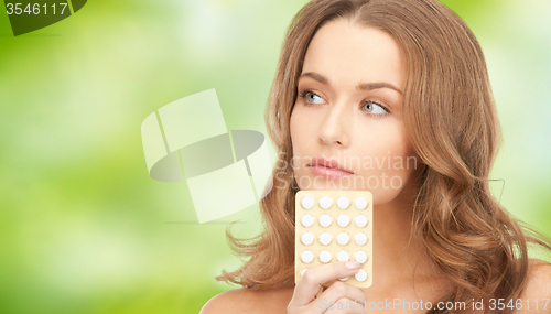 Image of beautiful young woman with medication