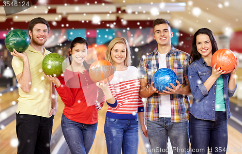 Image of happy friends in bowling club at winter season