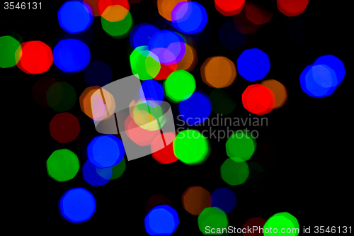 Image of colorful bright night lights over black background