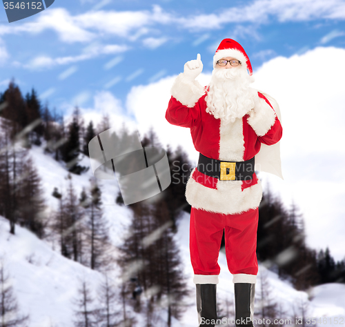 Image of man in costume of santa claus with bag