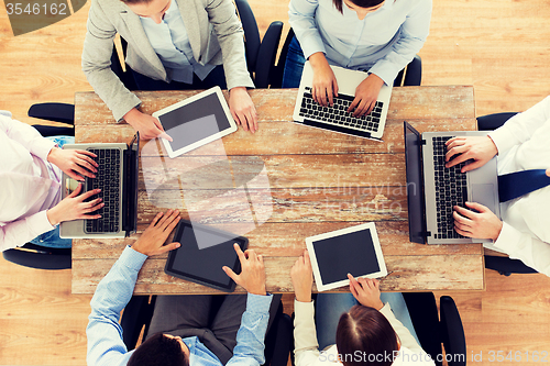 Image of business team with laptop and tablet pc