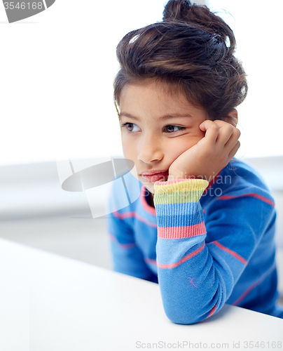 Image of sad little girl at home or school