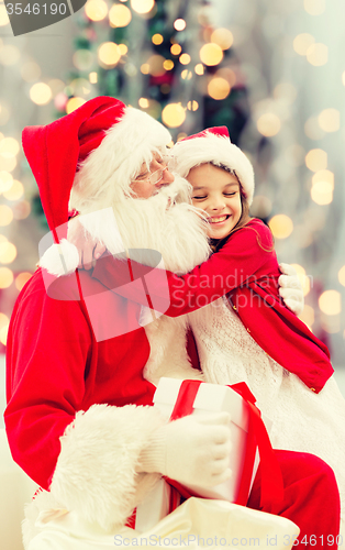 Image of smiling little girl with santa claus