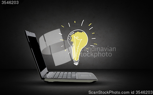 Image of open laptop computer with lighting bulb doodle