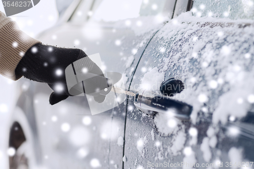 Image of close up of man with car key outdoors