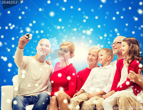 Image of smiling family with camera