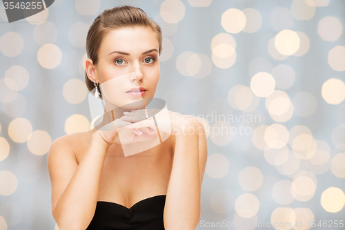 Image of beautiful woman with diamond earrings and bracelet