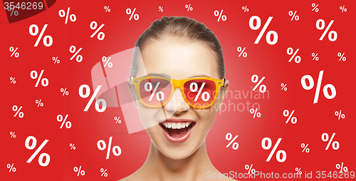 Image of happy teenage girl in shades with percentage signs