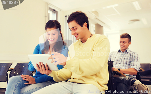 Image of group of smiling students with tablet pc