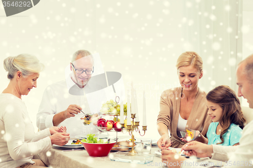 Image of smiling family having holiday dinner at home