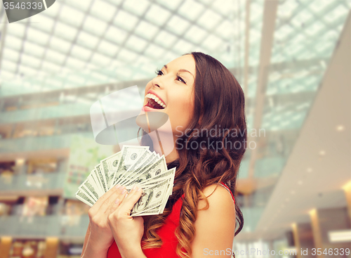 Image of woman in red dress with us dollar money