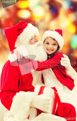 Image of smiling little girl with santa claus