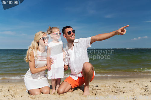 Image of happy family in sunglasses on summer beach