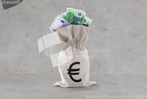 Image of close up of euro paper money in bag over concrete