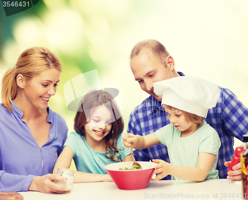 Image of happy family with two kids eating at home