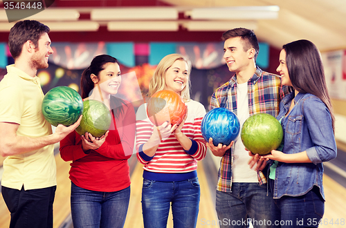 Image of happy friends in bowling club