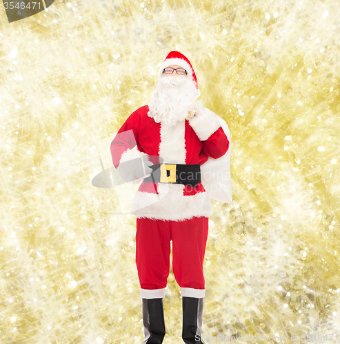 Image of man in costume of santa claus with bag