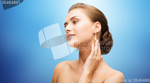 Image of beautiful woman with diamond earrings and bracelet