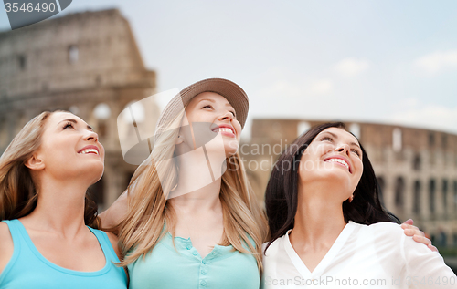 Image of group of happy young women over coliseum