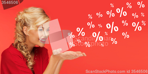 Image of woman with sale and percentage signs over red