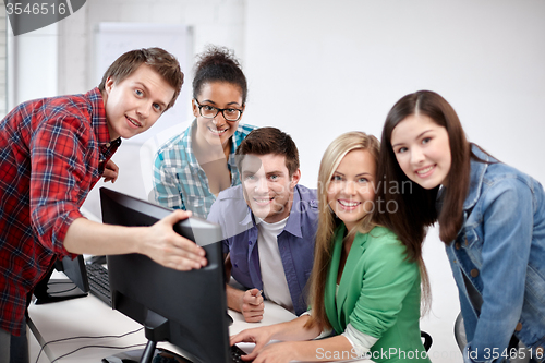 Image of happy high school students in computer class