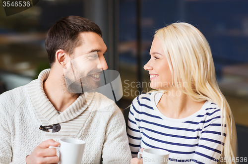 Image of happy couple meeting and drinking tea or coffee