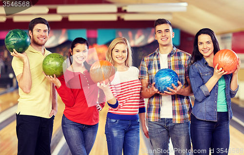 Image of happy friends in bowling club