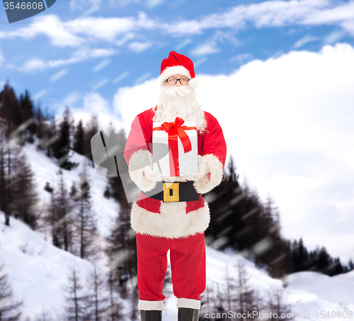 Image of man in costume of santa claus with gift box