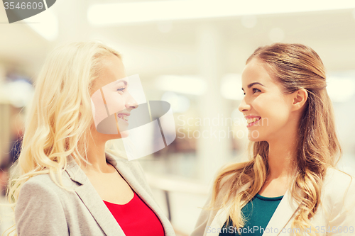 Image of happy young women in mall or business center