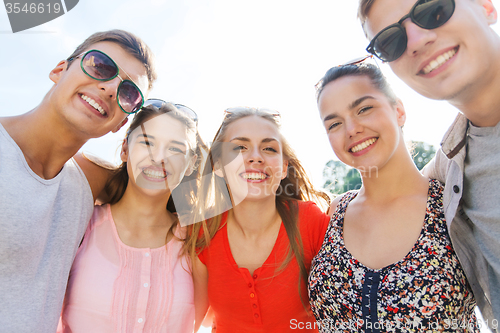 Image of smiling friends taking selfie