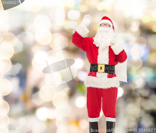 Image of man in costume of santa claus with bag