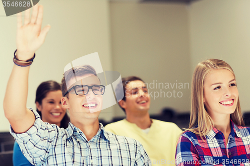 Image of group of smiling students in lecture hall