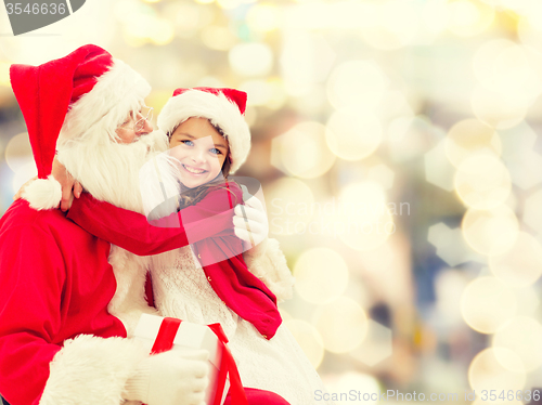 Image of smiling little girl with santa claus