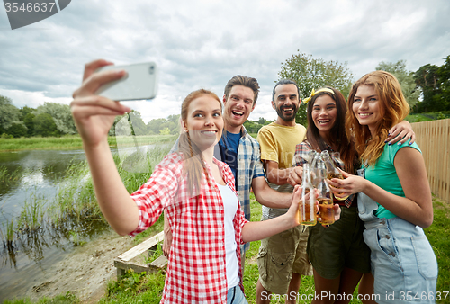 Image of happy friends taking selfie by smartphone