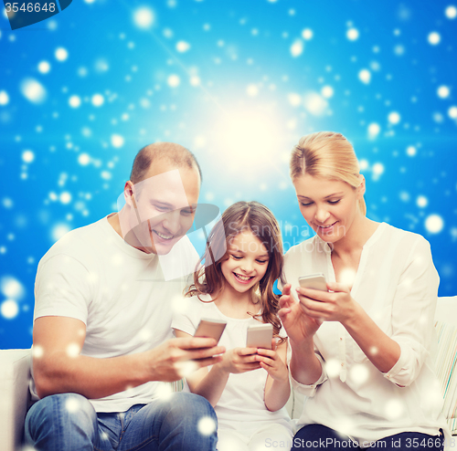 Image of happy family with smartphones