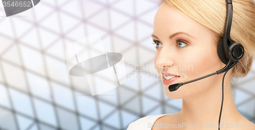 Image of helpline operator in headset over grid background