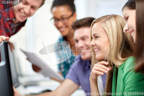 Image of happy high school students in computer class