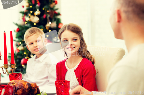 Image of smiling family having holiday dinner at home