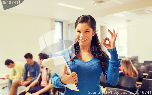 Image of group of smiling students in lecture hall