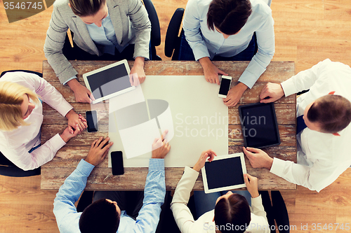 Image of business team with smartphones and tablet pc