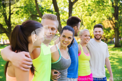 Image of group of happy friends or sportsmen outdoors